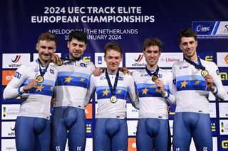 Daniel Bigham, Charlie Tanfield, Ethan Hayter, Oliver Wood, Ethan Vernon celebrate with gold medals on the podium for the Men's Team Pursuit finals