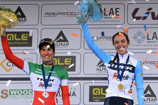 CITTIGLIO, ITALY - MARCH 19: (L-R) Elisa Balsamo of Italy and Team Trek - Segafredo on second place, race winner Shirin Van Anrooij of The Netherlands and Team Trek - Segafredo pose on the podium ceremony after the 24th Trofeo Alfredo Binda-Comune di Cittiglio 2023 - Women's Elite a 139km one day race from Maccagno con Pino e Veddasca to Cittiglio / #UCIWWT / on March 19, 2023 in Cittiglio, Italy. (Photo by Dario Belingheri/Getty Images)