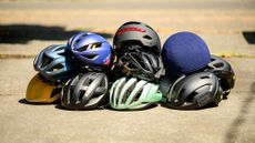 Group shot of road bike helmets on a sunny day